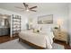 Bright bedroom with a ceiling fan, decorative shelves and attached bathroom at 108 Great Oaks Lane, Roswell, GA 30075