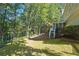 Lush backyard with trees and ample space for outdoor activities at 1678 Valor Ridge Nw Dr, Kennesaw, GA 30152