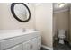 A bathroom with a single sink vanity and mirror at 1678 Valor Ridge Nw Dr, Kennesaw, GA 30152