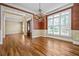 Dining room with chandelier, hardwood floors, wainscoting and view of entry at 1678 Valor Ridge Nw Dr, Kennesaw, GA 30152