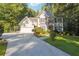 Charming two-story home with a well-manicured lawn and a long driveway leading to a two-car garage at 1678 Valor Ridge Nw Dr, Kennesaw, GA 30152