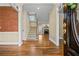 Elegant foyer with hardwood floors, staircase, and views into the living room at 1678 Valor Ridge Nw Dr, Kennesaw, GA 30152