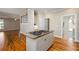 Kitchen island with a cooktop and granite countertops at 1678 Valor Ridge Nw Dr, Kennesaw, GA 30152