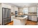 Modern kitchen with stainless steel appliances, granite countertops, and a center island at 1678 Valor Ridge Nw Dr, Kennesaw, GA 30152