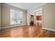 Bright living room featuring a large window and hardwood floors at 1678 Valor Ridge Nw Dr, Kennesaw, GA 30152