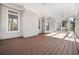 Open-air porch featuring a ceiling fan and a warm wooden floor finish at 1678 Valor Ridge Nw Dr, Kennesaw, GA 30152