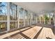 Relaxing screened porch with a wooden floor, offering serene views of the surrounding nature at 1678 Valor Ridge Nw Dr, Kennesaw, GA 30152