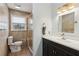 Tiled bathroom featuring a glass shower, white vanity with dark cabinets, and modern fixtures at 3250 N Embry Cir, Atlanta, GA 30341