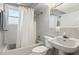 Bathroom featuring tiled shower-tub, toilet, and vanity with soft grey aesthetic at 3250 N Embry Cir, Atlanta, GA 30341