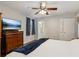 Bright bedroom with hardwood floors featuring a television and ensuite bathroom at 3250 N Embry Cir, Atlanta, GA 30341