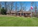 Charming brick home with a manicured lawn and welcoming front porch perfect for relaxing outdoors at 3250 N Embry Cir, Atlanta, GA 30341