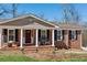 Inviting front porch with seating area and brick pathway to enter this traditional home at 3250 N Embry Cir, Atlanta, GA 30341