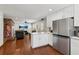 Open-concept kitchen with stainless steel appliances, island, and a view into the living area at 3250 N Embry Cir, Atlanta, GA 30341