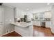 Modern kitchen featuring white cabinetry, stainless steel appliances, granite countertops and hardwood floors at 3250 N Embry Cir, Atlanta, GA 30341