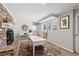 Living room with carpet, decorative fireplace, and work desk in a bright space at 3250 N Embry Cir, Atlanta, GA 30341