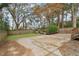 Large backyard featuring a concrete patio, grass area and stone landscaping, perfect for outdoor entertaining at 761 Bellemeade Nw Ave, Atlanta, GA 30318