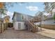 Home exterior showcasing a wooden deck with stairs and a spacious backyard area featuring string lights at 761 Bellemeade Nw Ave, Atlanta, GA 30318