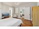 Bedroom showcasing hardwood floors, white doors, and an open doorway to the dining room at 761 Bellemeade Nw Ave, Atlanta, GA 30318