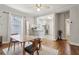 Bright dining room with hardwood floors, white ceiling, natural light, and open to the kitchen at 761 Bellemeade Nw Ave, Atlanta, GA 30318