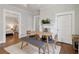 Dining room with hardwood floors and brick fireplace, bench seating, and view to bedroom at 761 Bellemeade Nw Ave, Atlanta, GA 30318