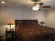 Bedroom featuring a ceiling fan with light fixture and dark furniture at 1013 Canyon Point Cir, Roswell, GA 30076