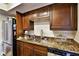 Kitchen featuring stainless steel appliances, granite counter tops and wooden cabinets at 1013 Canyon Point Cir, Roswell, GA 30076