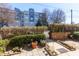 Rear patio and garden area with mature landscaping at 375 Highland Ne Ave # 503, Atlanta, GA 30312