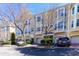 Street view of well-maintained townhome exteriors featuring garages and detailed landscaping at 375 Highland Ne Ave # 503, Atlanta, GA 30312