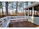 Back porch featuring a white bench and a screened door at 4020 Winchester Way, Loganville, GA 30052