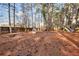 Large, tree-filled backyard with playground and playhouse offering ample space and recreation at 4020 Winchester Way, Loganville, GA 30052