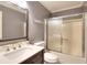Bathroom featuring a single sink vanity, toilet, and shower-tub combo at 4020 Winchester Way, Loganville, GA 30052