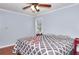 Spacious bedroom with wood floors, ceiling fan, natural light and light blue walls at 4020 Winchester Way, Loganville, GA 30052