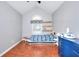 Bright bedroom featuring vaulted ceilings, wood floors, and a boat shaped bed frame at 4020 Winchester Way, Loganville, GA 30052