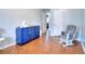 Bedroom featuring a blue dresser, rocker, and view into another room at 4020 Winchester Way, Loganville, GA 30052