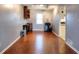 Bonus room with wood floors, a window, and track lighting at 4020 Winchester Way, Loganville, GA 30052