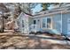 Charming light blue home with decorative window shutters and a welcoming front porch entrance at 4020 Winchester Way, Loganville, GA 30052