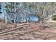 Cozy light blue home with brick-lined garden beds, an inviting front porch, and a two-car garage at 4020 Winchester Way, Loganville, GA 30052