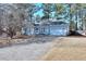 Charming light blue home featuring a manicured lawn and a two-car garage, creating a welcoming curb appeal at 4020 Winchester Way, Loganville, GA 30052