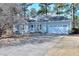 Charming light blue home featuring a manicured lawn and a two-car garage, creating a welcoming curb appeal at 4020 Winchester Way, Loganville, GA 30052
