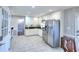 Kitchen features stainless steel appliances and white cabinetry at 4020 Winchester Way, Loganville, GA 30052