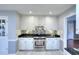 Updated kitchen offers stainless steel appliances, lots of cabinet space, and modern tile backsplash at 4020 Winchester Way, Loganville, GA 30052