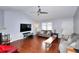 Bright living room features hardwood floors, vaulted ceilings, and lots of natural light at 4020 Winchester Way, Loganville, GA 30052