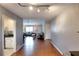 Open-concept floor plan features a light-filled living room with hardwood floors at 4020 Winchester Way, Loganville, GA 30052