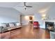 Spacious living room featuring hardwood floors and a fireplace, creating a cozy atmosphere at 4020 Winchester Way, Loganville, GA 30052