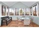 Enclosed sunroom with tongue and groove walls and ceiling, and wood flooring at 4020 Winchester Way, Loganville, GA 30052