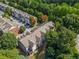 Aerial view showcases the home's location in a lush, green, and wooded area at 5341 Concordia Se Pl # 8, Mableton, GA 30126