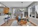 Dining room with a chandelier, windows with backyard view, and breakfast bar at 218 Sutallee Ridge Ne Ct, White, GA 30184