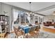 Well-lit dining room with hardwood floors open to the fireplace and living room at 218 Sutallee Ridge Ne Ct, White, GA 30184