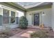 Inviting front entrance with brick pathway, stylish lighting, and a charming wreath on the door at 218 Sutallee Ridge Ne Ct, White, GA 30184