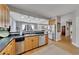 Spacious kitchen featuring stainless steel appliances and open layout to living area at 218 Sutallee Ridge Ne Ct, White, GA 30184